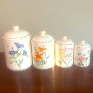Four piece set of Windemere Garden porcelain vintage canisters. Pre-owned.